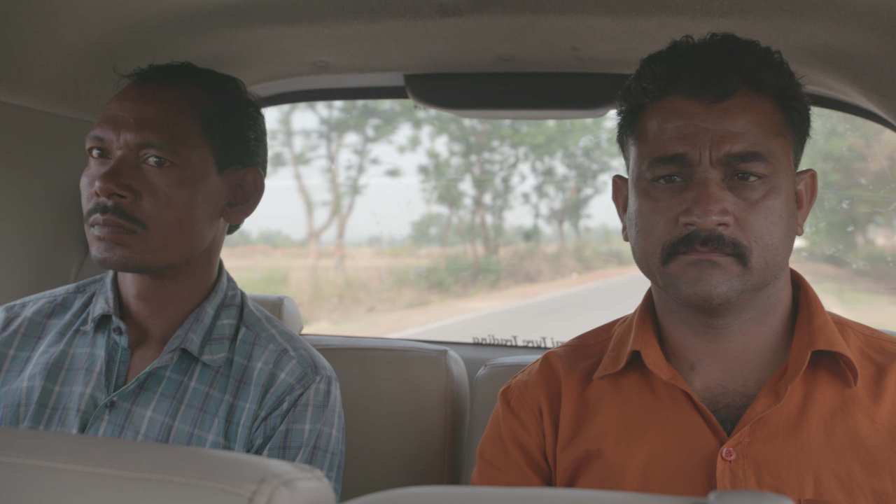 two men in a car
